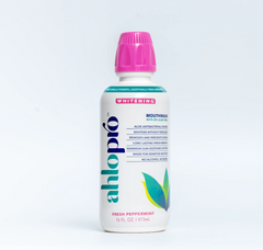 Bottle of Ahlopro mouthwash with a pink cap on a white background