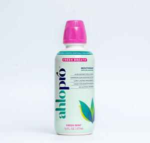 Ahlo Pro mouthwash bottle with pink cap on a light gray background