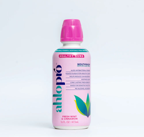 Pink bottle of Alopro mouthwash on a light gray background