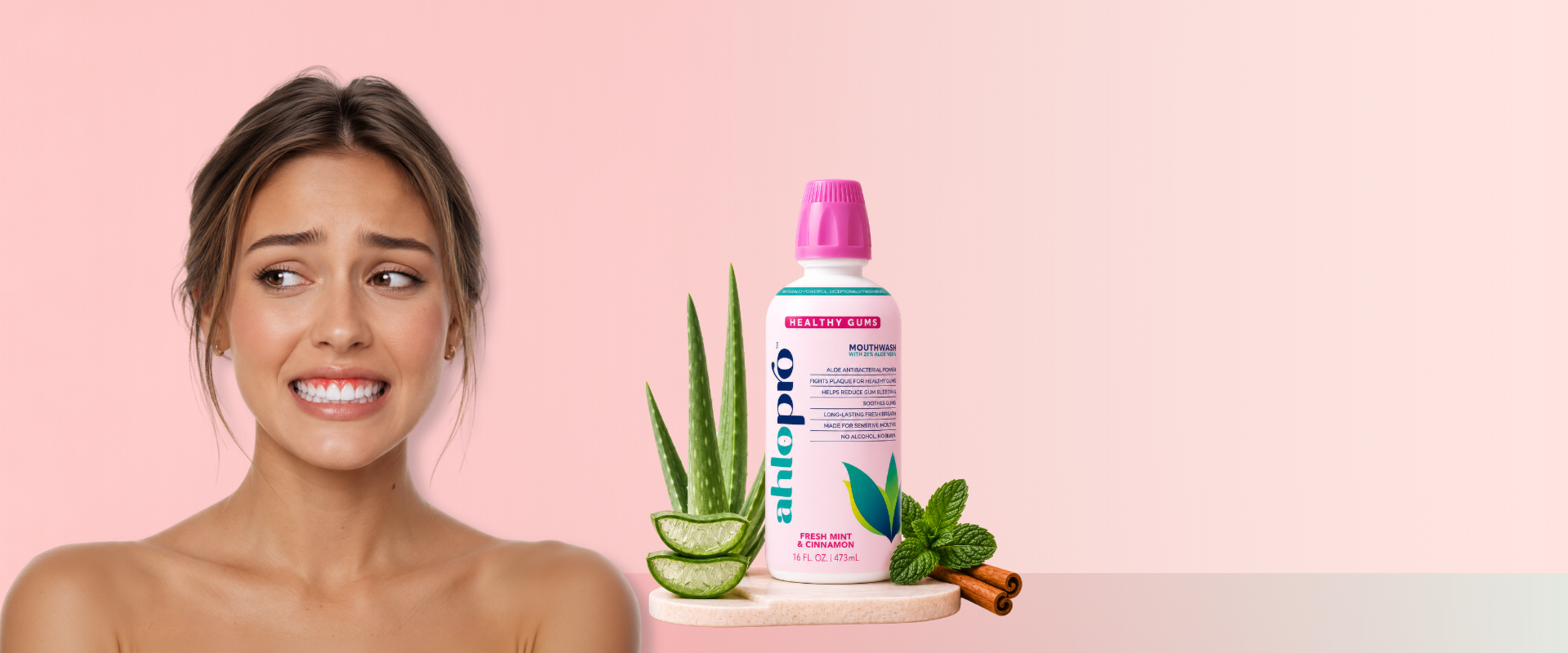 Woman with a bottle of aloe pro health gums and aloe vera plant on a pink background
