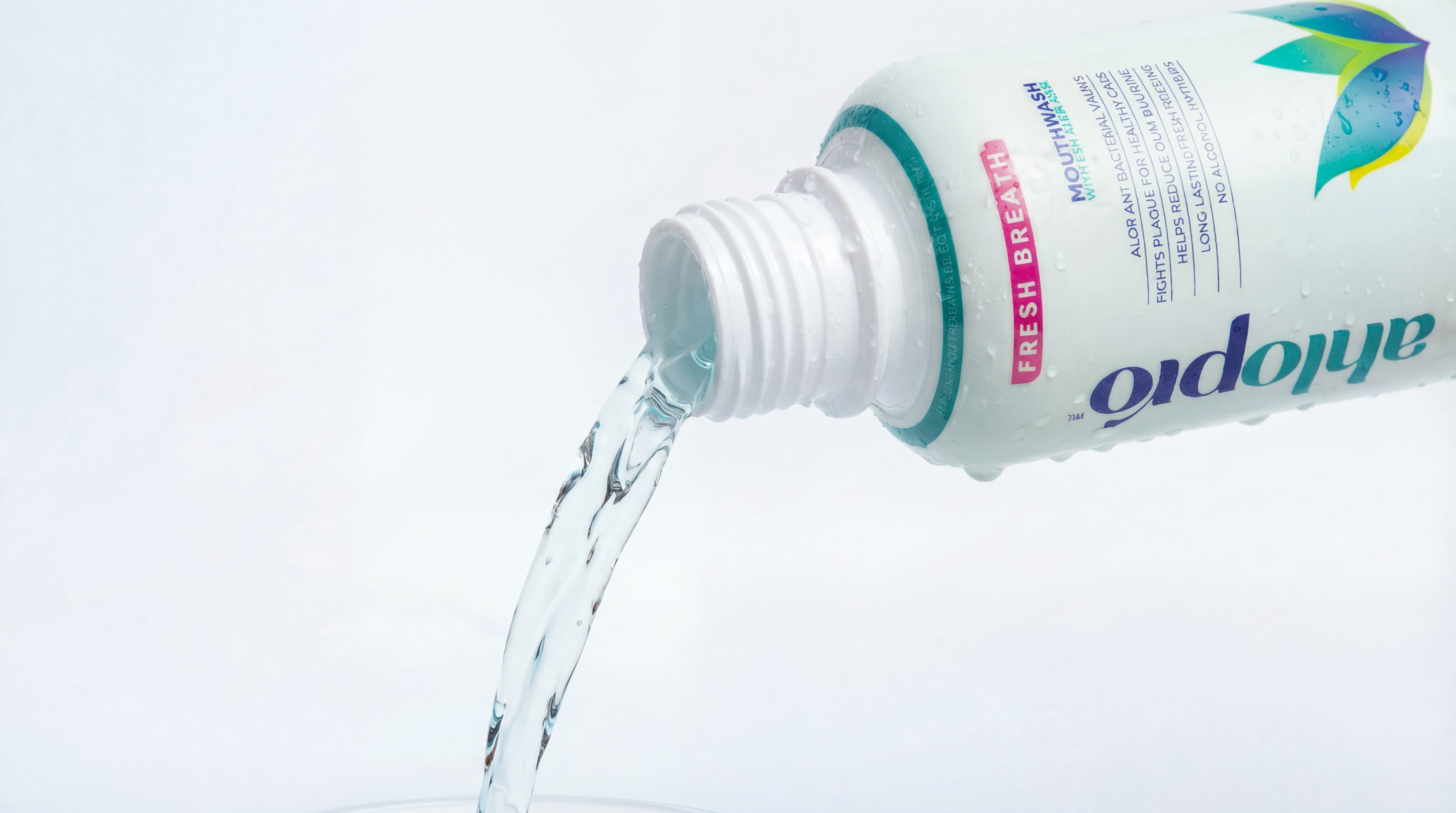 AHLOPRO bottle with liquid being poured on a white background