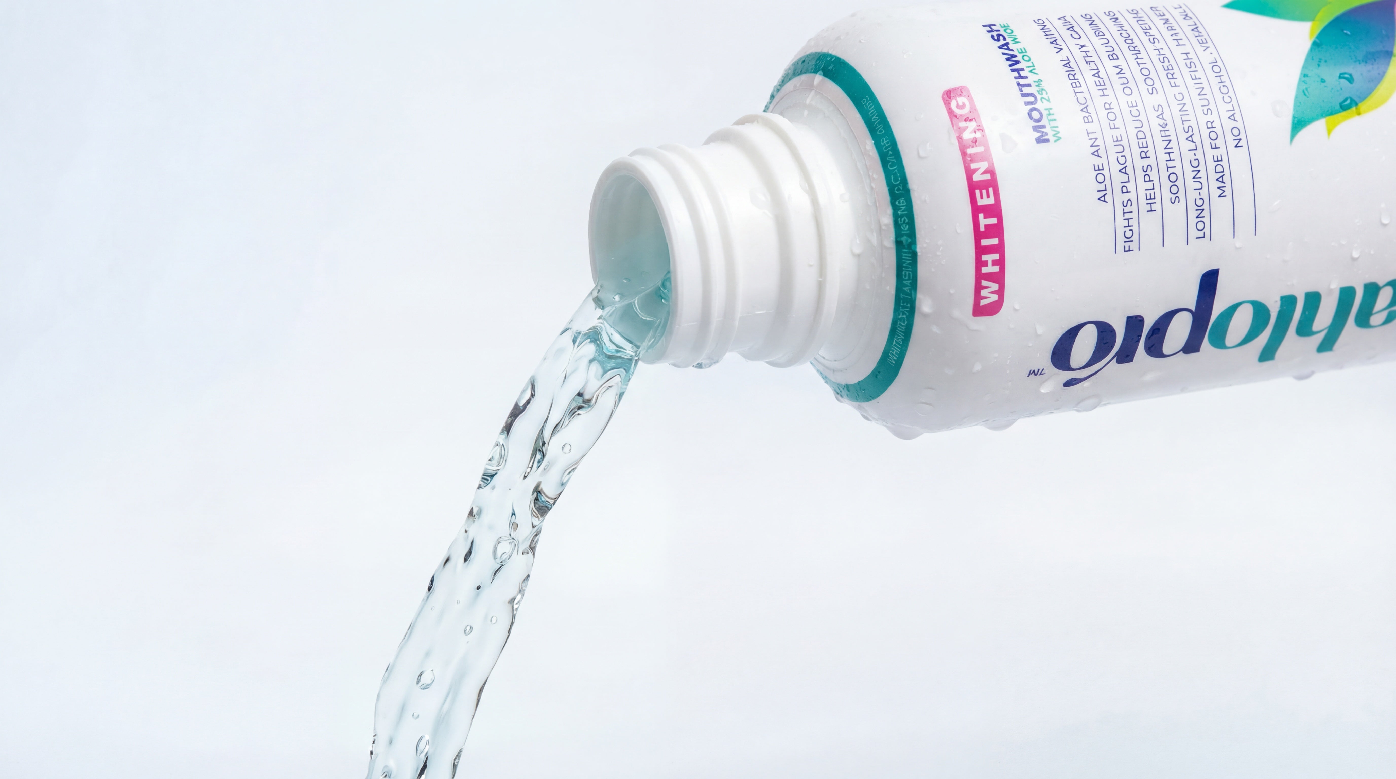 Bottle of AhloPro pouring water onto a white background