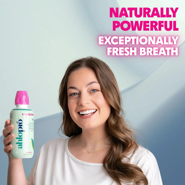 Woman holding a bottle of ahlopo with text about fresh breath on a light blue background